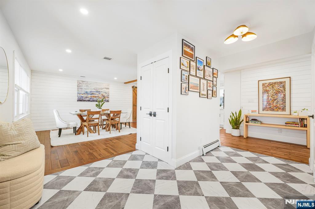 10 Winonah Avenue Wayne, NJ 07470 - Photo 4 of 41 a living room with furniture and a rug