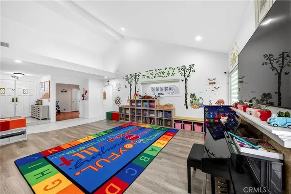 a bed room with furniture and a table