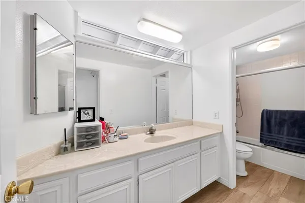 a bathroom with a toilet and a shower curtain