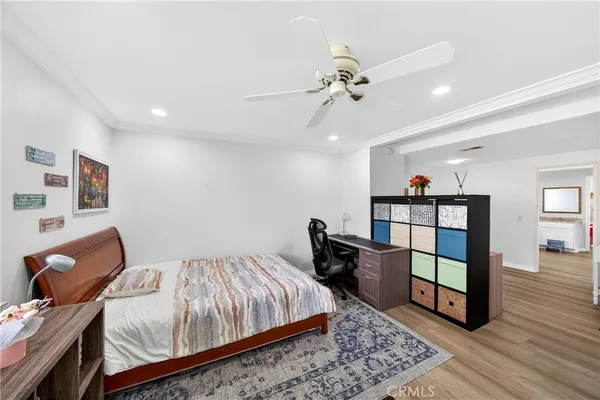 a bedroom with bed and a couch