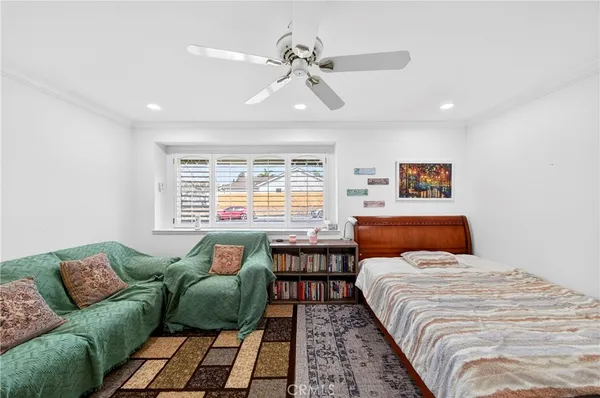 an empty room with wooden floor and white walls
