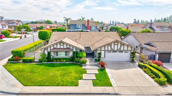 a aerial view of a house with a yard