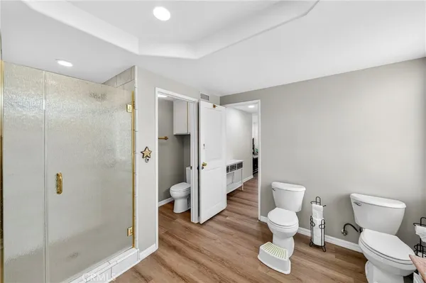 a living room with furniture and a book shelf