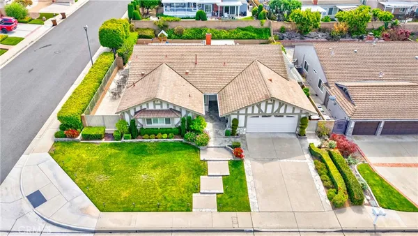 an aerial view of a house with a swimming pool