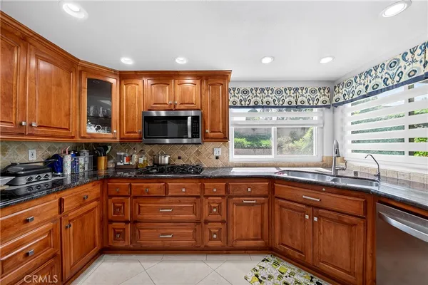 a view of a patio with a table and chairs