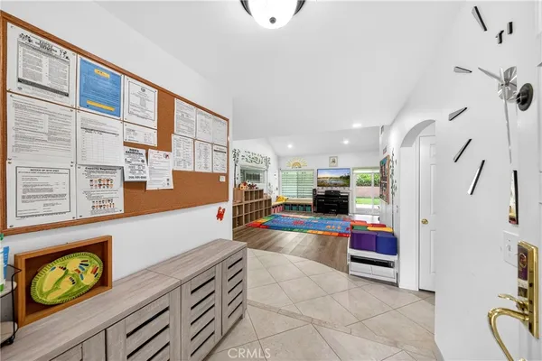 a view of a livingroom with furniture and a chandelier
