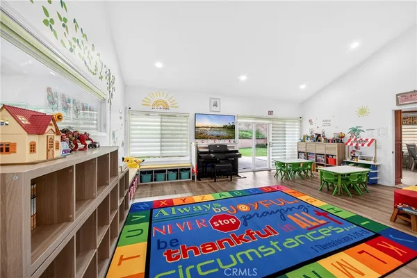 a living room with lots of furniture and toys