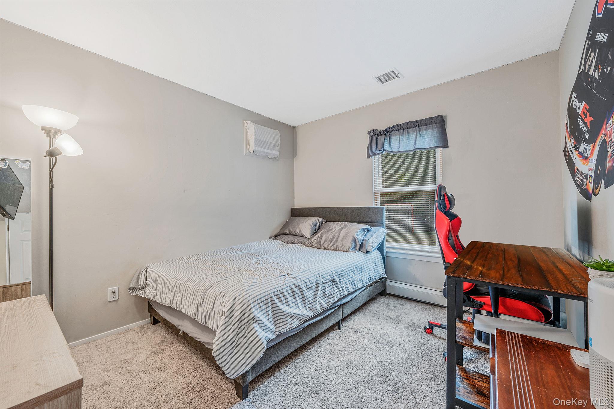 5 Hastings Drive Ridge, NY 11961 - Photo 15 of 31 a bedroom with a bed and a closet