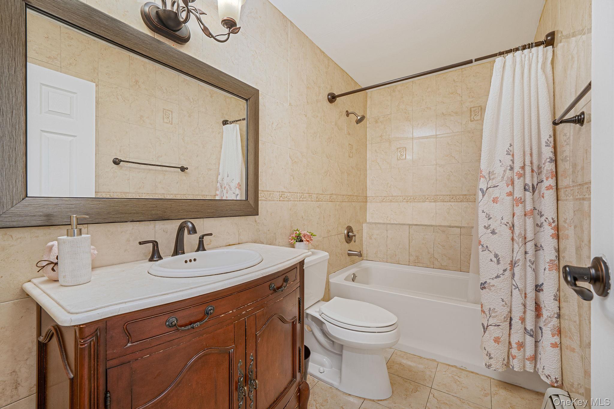 5 Hastings Drive Ridge, NY 11961 - Photo 18 of 31 a bathroom with a sink toilet a mirror and shower
