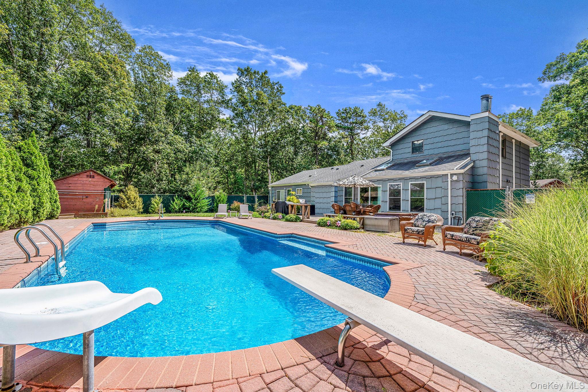 5 Hastings Drive Ridge, NY 11961 - Photo 25 of 31 swimming pool view with a seating space