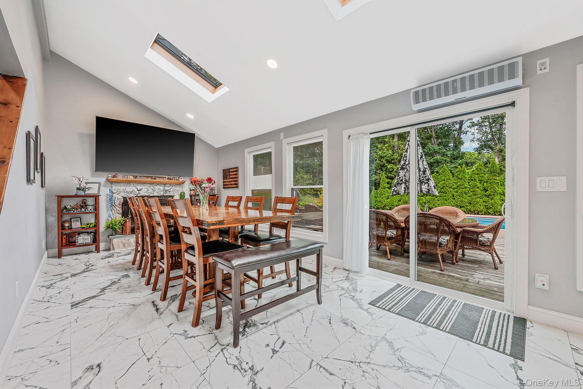 5 Hastings Drive Ridge, NY 11961 - Photo 10 of 31 a view of a dining room with furniture window and outside view