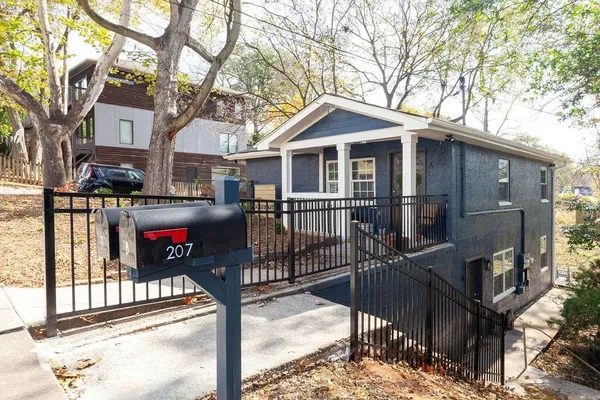 a front view of a house with glass windows