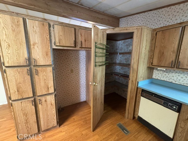 27701 Murrieta Road, Unit 255 Menifee, CA 92586 - Photo 11 of 20 a view of walk in closet with empty racks