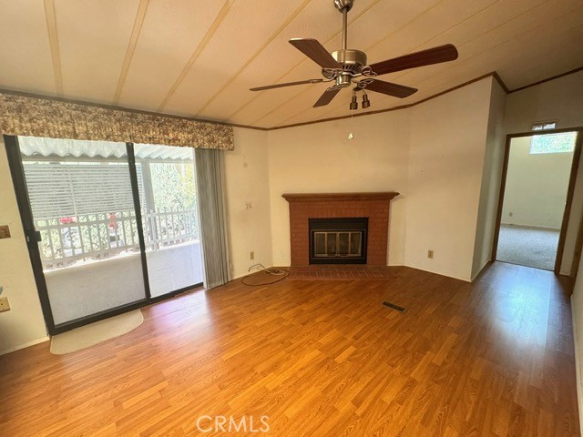27701 Murrieta Road, Unit 255 Menifee, CA 92586 - Photo 13 of 20 a view of an empty room with a fireplace and a window