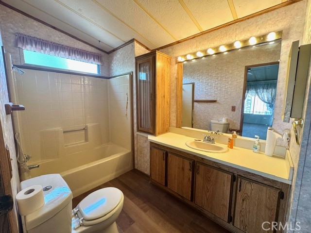 27701 Murrieta Road, Unit 255 Menifee, CA 92586 - Photo 15 of 20 a bathroom with a sink a toilet a mirror a bathtub and shower