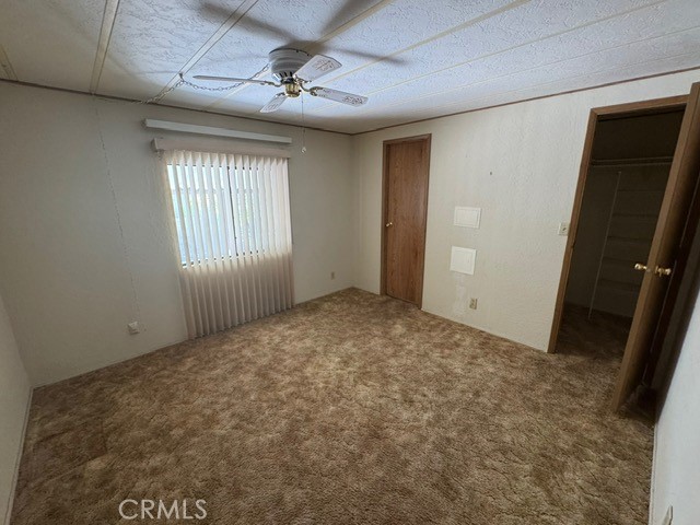 27701 Murrieta Road, Unit 255 Menifee, CA 92586 - Photo 16 of 20 en empty room with windows