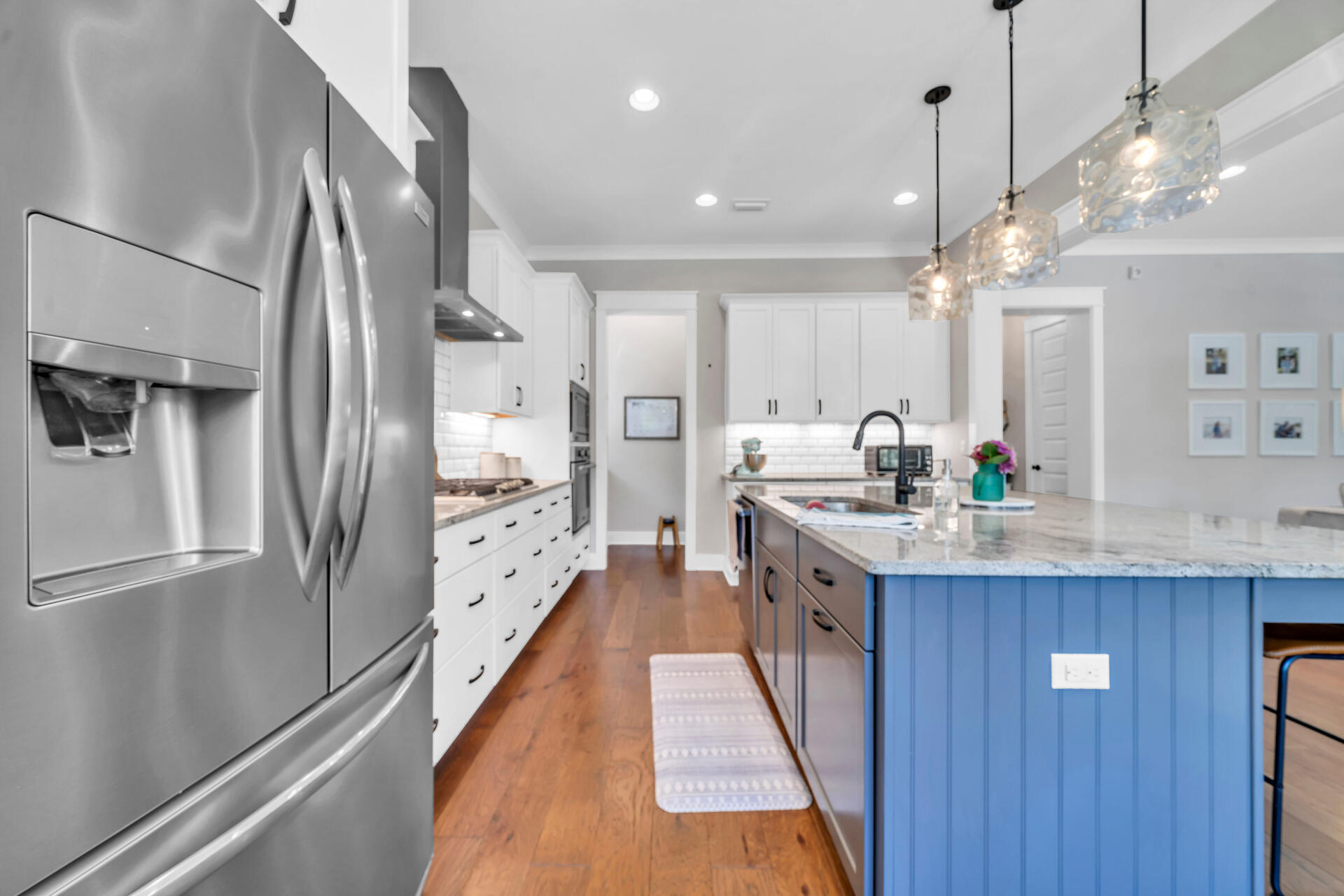 1244 Elderflower Drive Niceville, FL 32578 - Photo 15 of 74 a large kitchen with stainless steel appliances kitchen island granite countertop a refrigerator and a sink