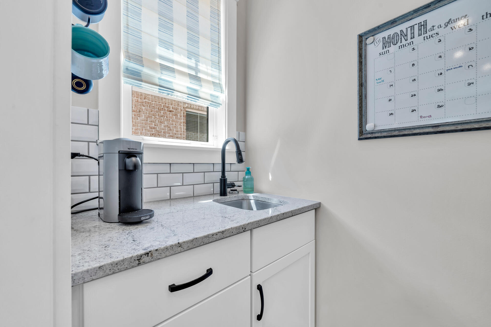1244 Elderflower Drive Niceville, FL 32578 - Photo 18 of 74 a kitchen with granite countertop a sink and a window