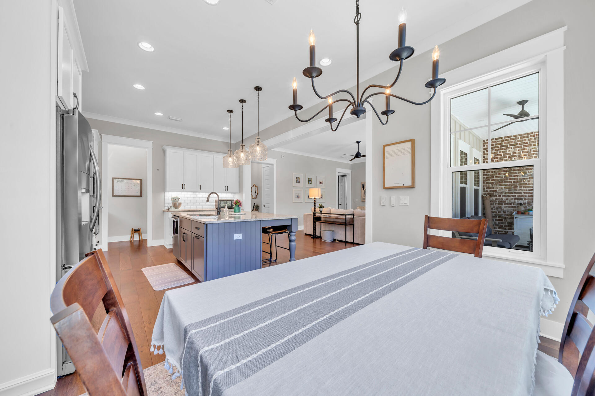 1244 Elderflower Drive Niceville, FL 32578 - Photo 22 of 74 a bedroom with furniture a large window and a chandelier