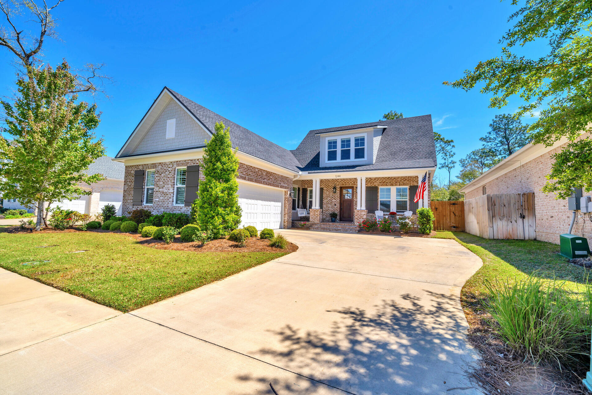 1244 Elderflower Drive Niceville, FL 32578 - Photo 3 of 74 a front view of a house with a yard