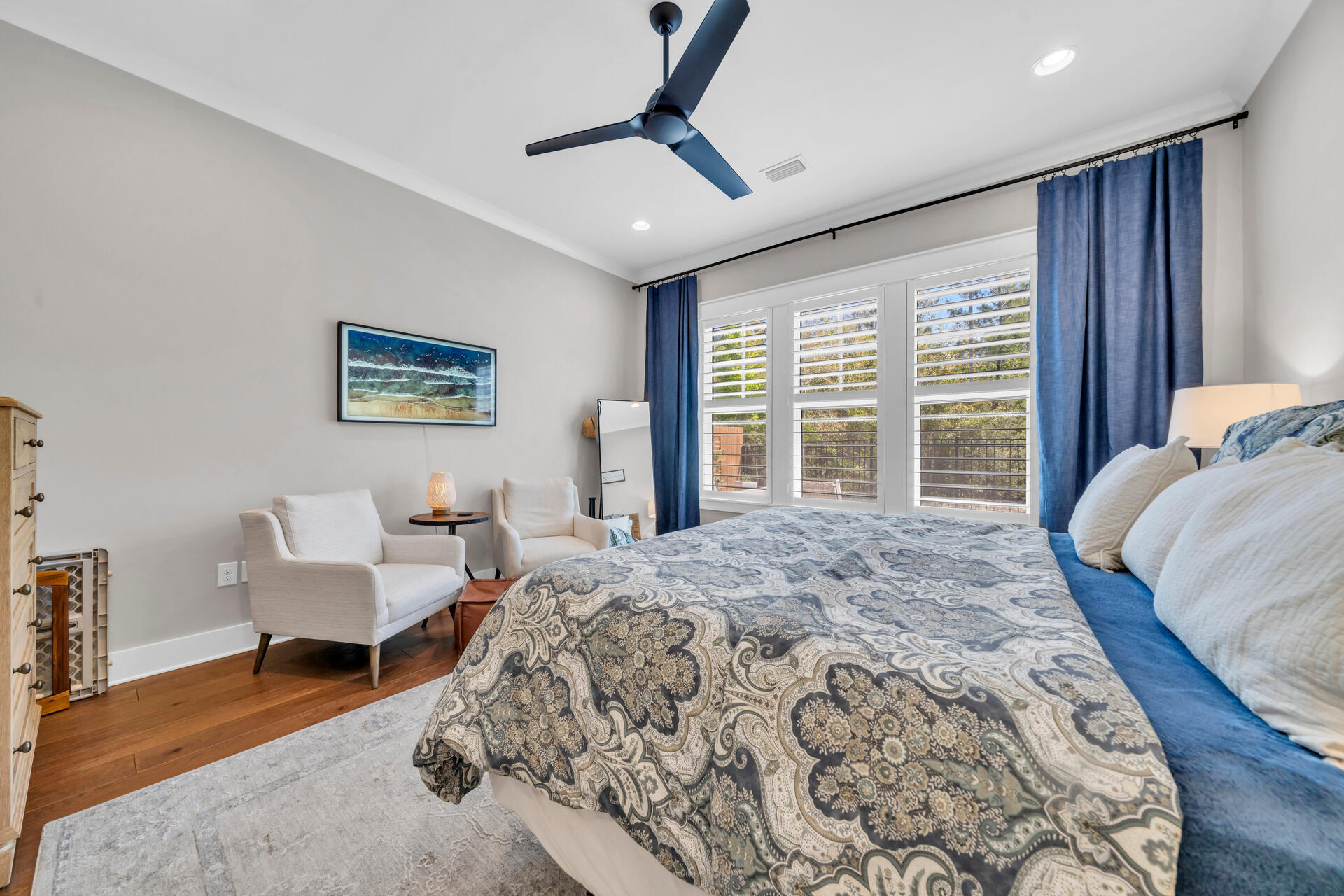 1244 Elderflower Drive Niceville, FL 32578 - Photo 31 of 74 a spacious bedroom with a bed a couch and a window