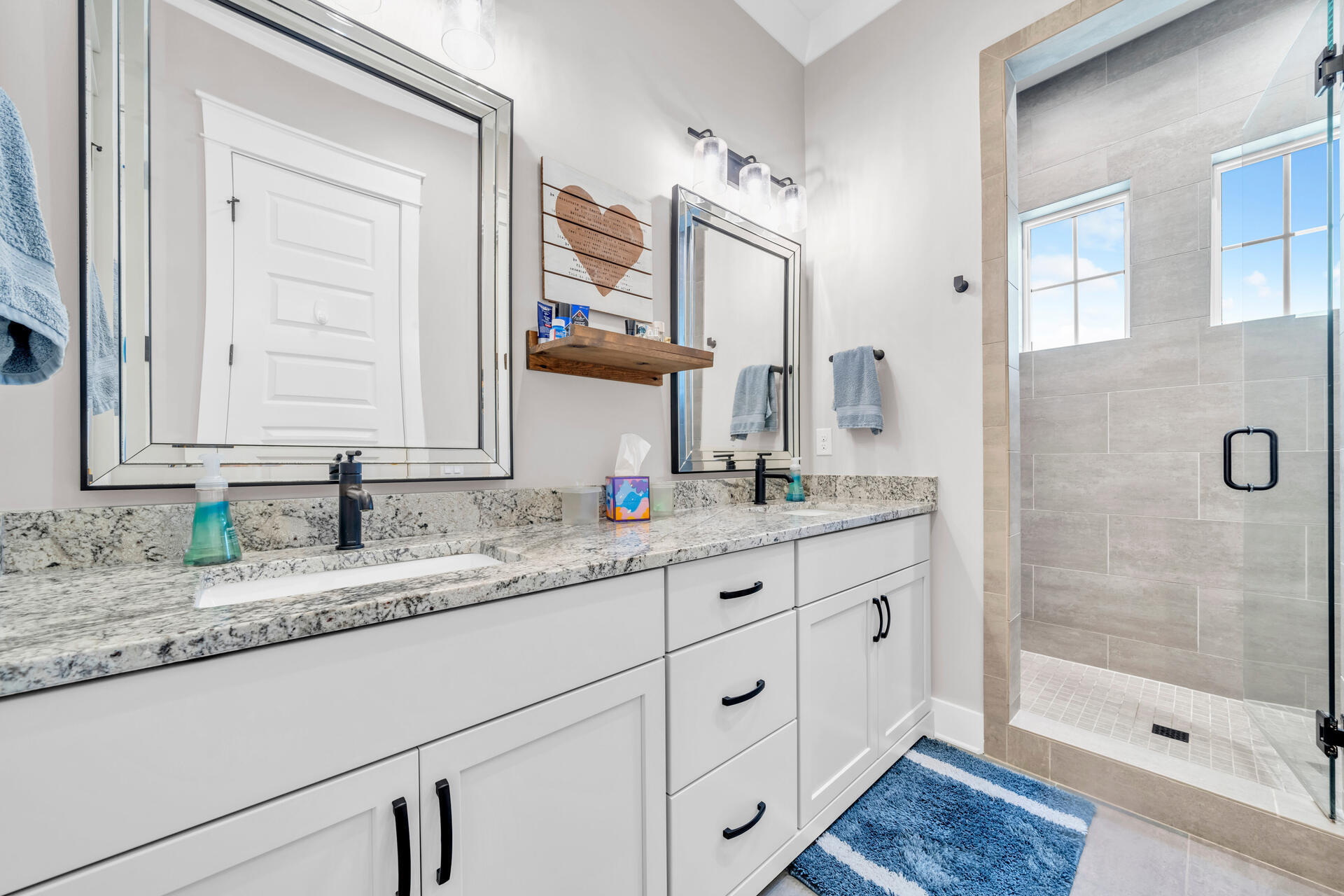 1244 Elderflower Drive Niceville, FL 32578 - Photo 36 of 74 a bathroom with a granite countertop sink mirror and