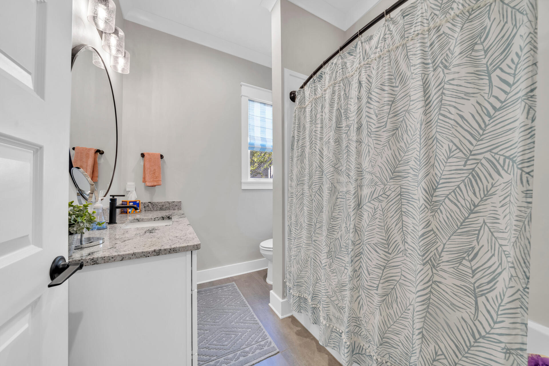 1244 Elderflower Drive Niceville, FL 32578 - Photo 39 of 74 a bathroom with a sink and mirror with toilet