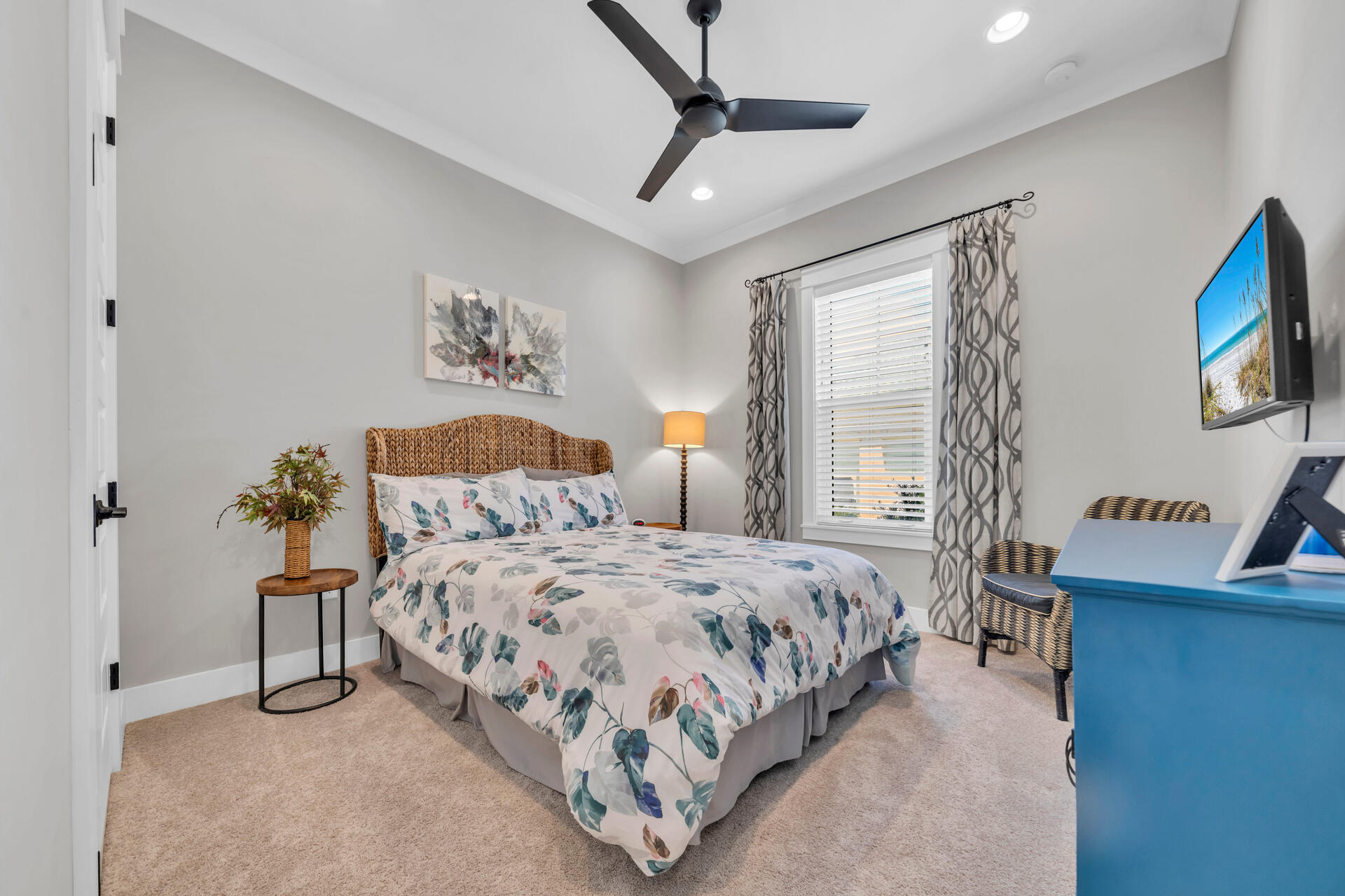 1244 Elderflower Drive Niceville, FL 32578 - Photo 41 of 74 a bedroom with a bed flat screen tv and a large window