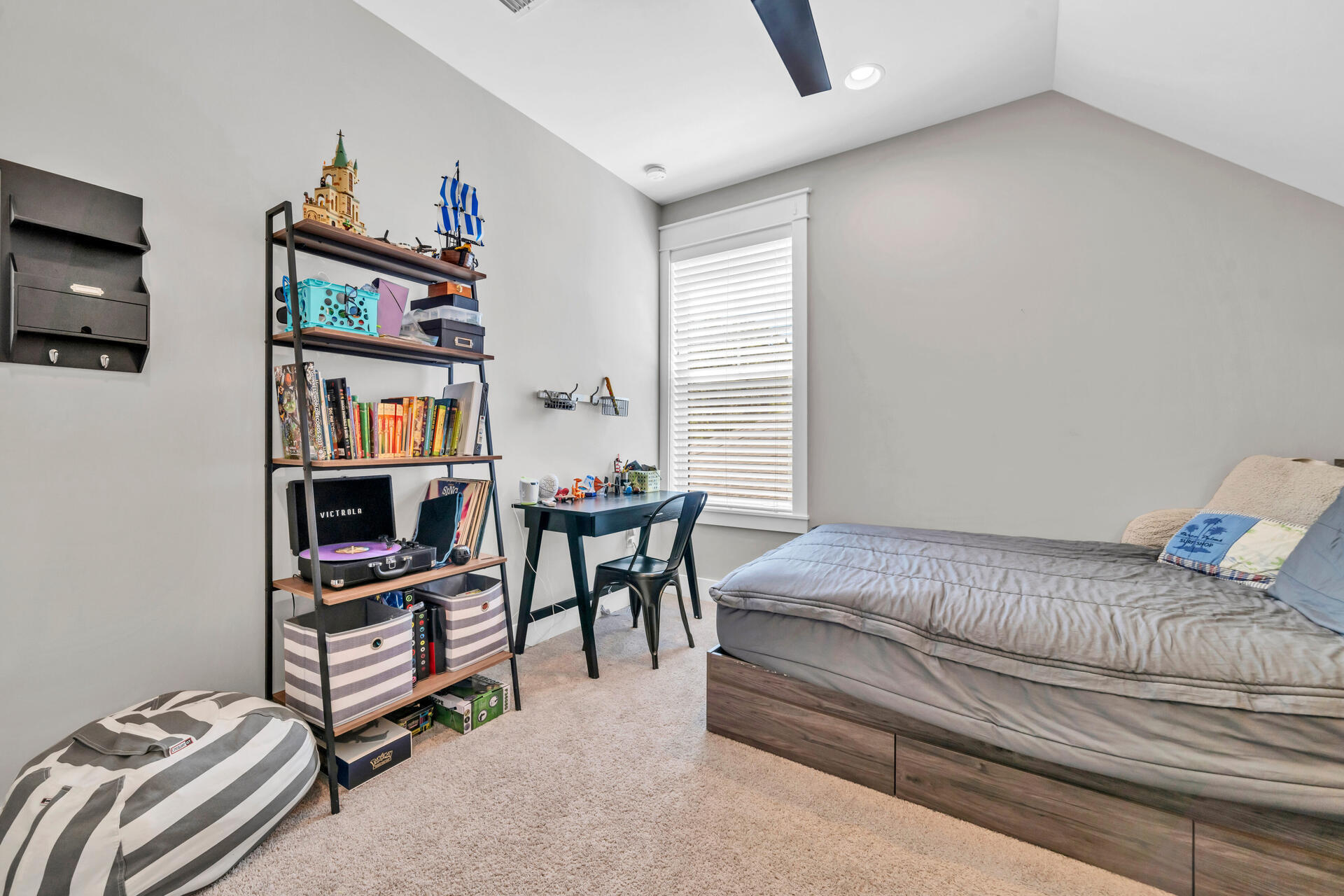 1244 Elderflower Drive Niceville, FL 32578 - Photo 47 of 74 a bedroom with furniture and a book shelf
