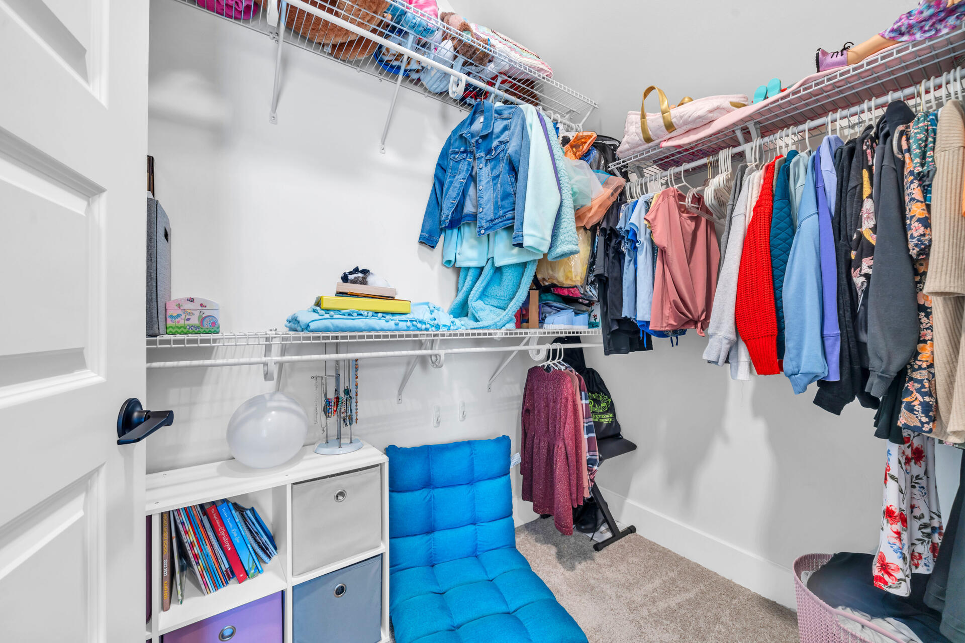 1244 Elderflower Drive Niceville, FL 32578 - Photo 53 of 74 a view of walk in closet with clothes and shoes
