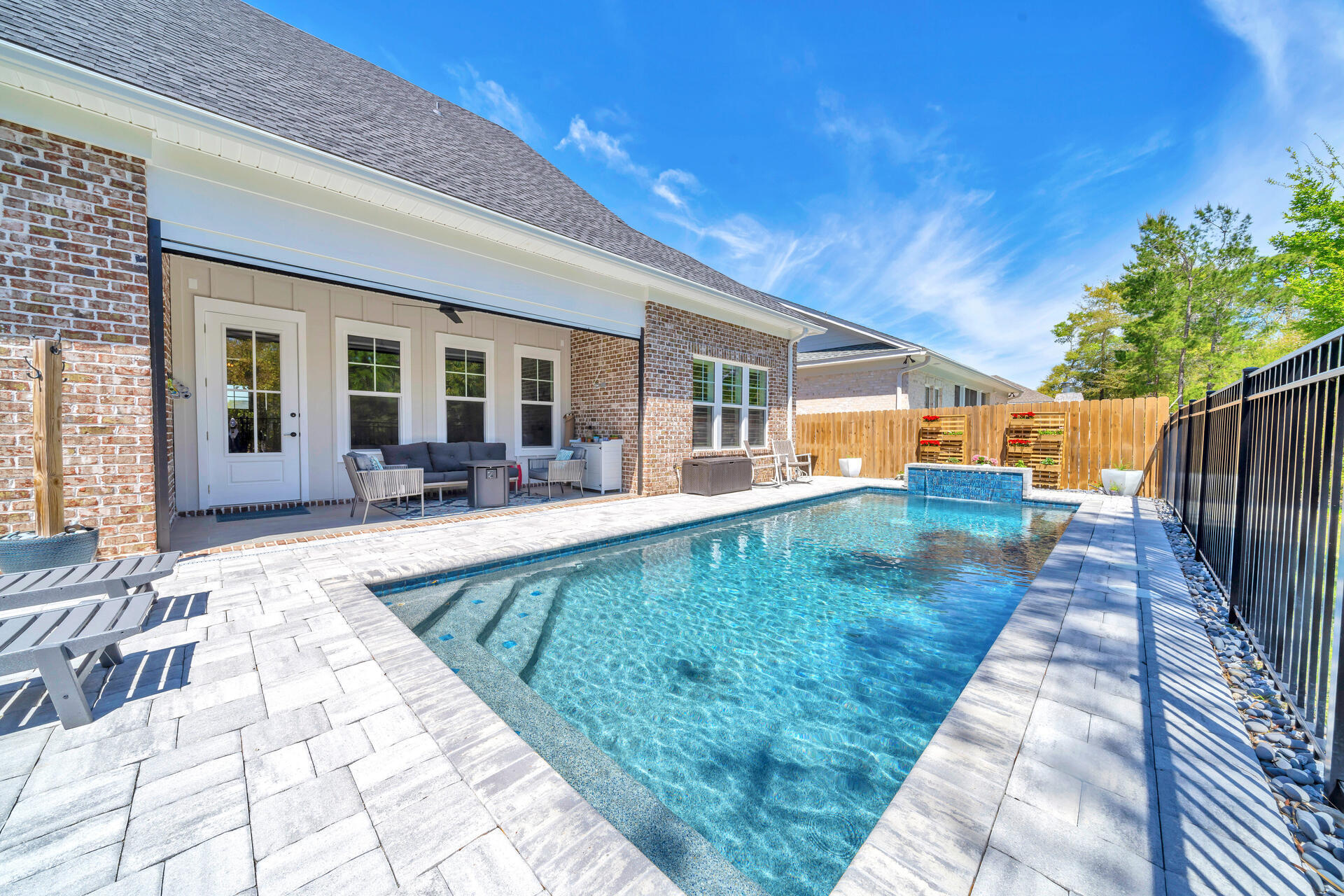1244 Elderflower Drive Niceville, FL 32578 - Photo 60 of 74 a view of a house with backyard porch and sitting area