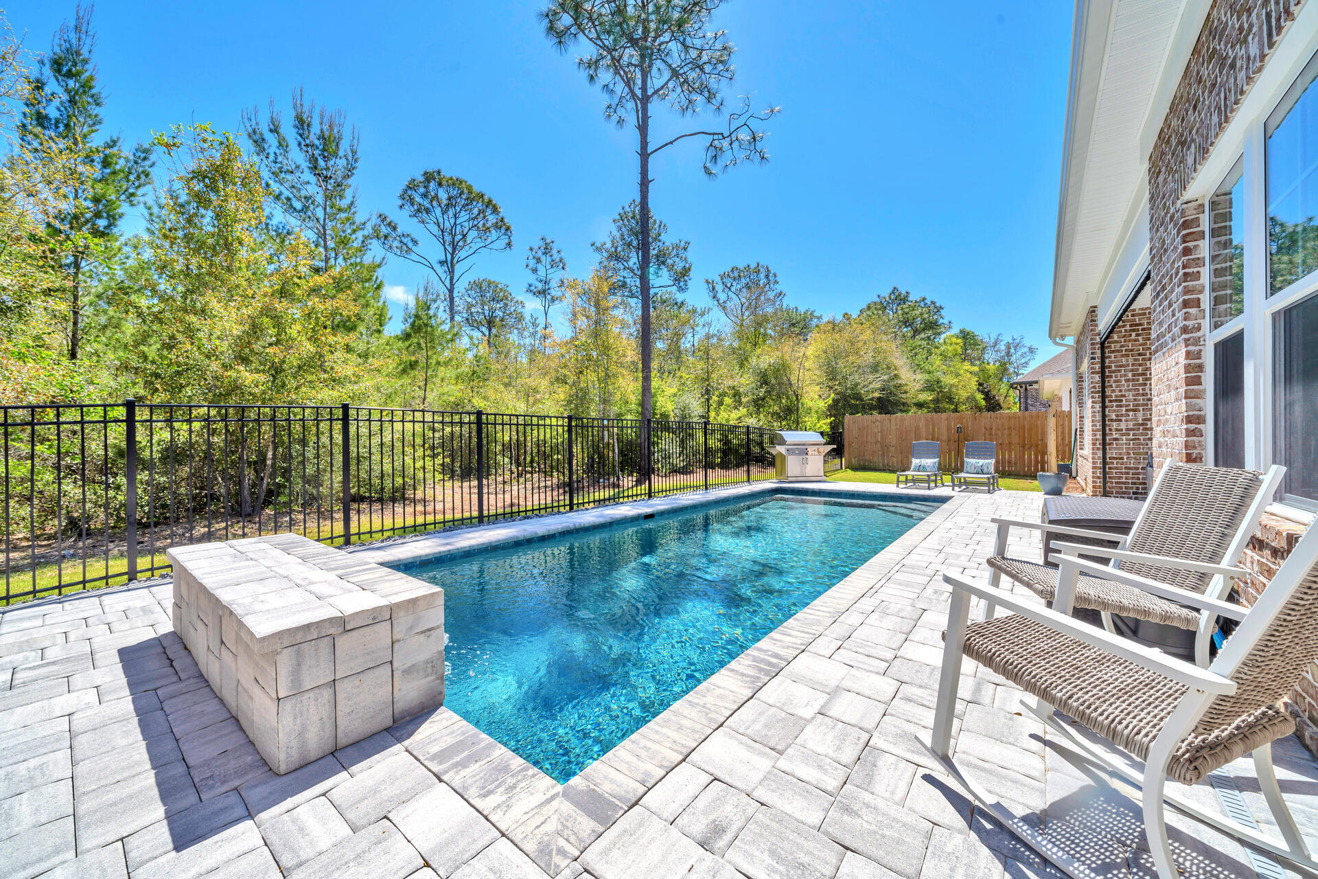 1244 Elderflower Drive Niceville, FL 32578 - Photo 63 of 74 a view of swimming pool with outdoor seating and plants