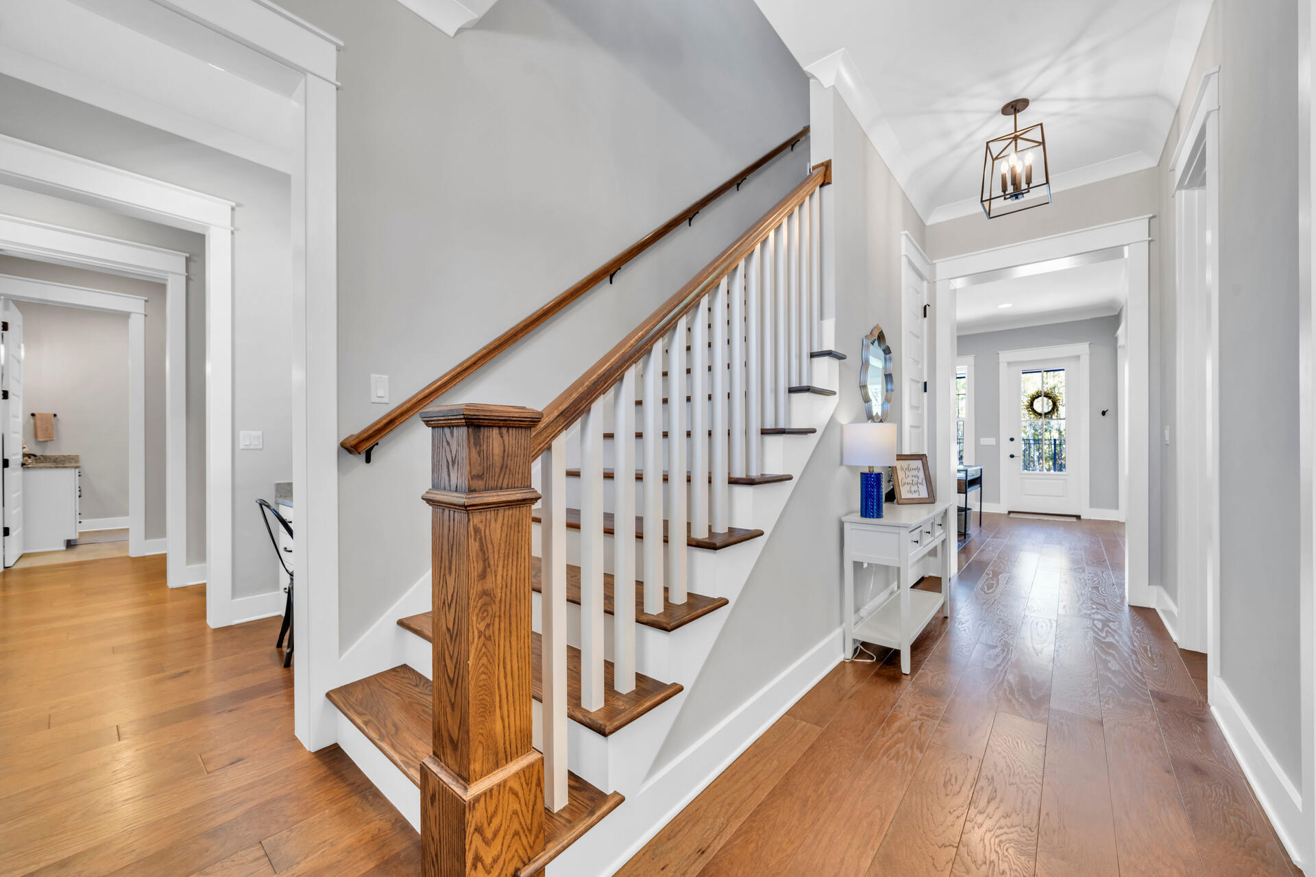 1244 Elderflower Drive Niceville, FL 32578 - Photo 8 of 74 a view of entryway with wooden floor and stairs