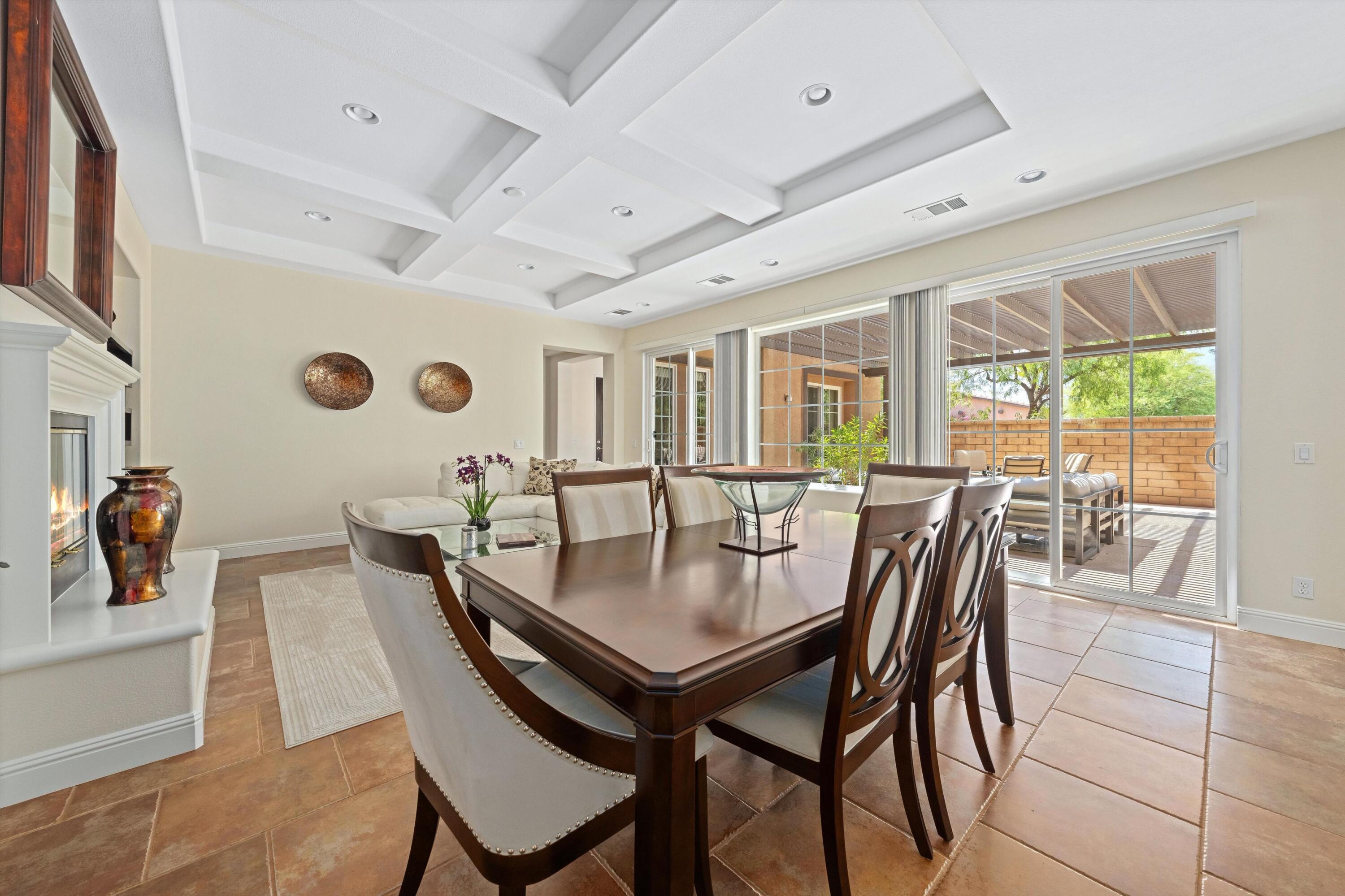 2 Via Santa Elena Rancho Mirage, CA 92270 - Photo 13 of 51 a view of a dining room and livingroom with furniture wooden floor and a rug