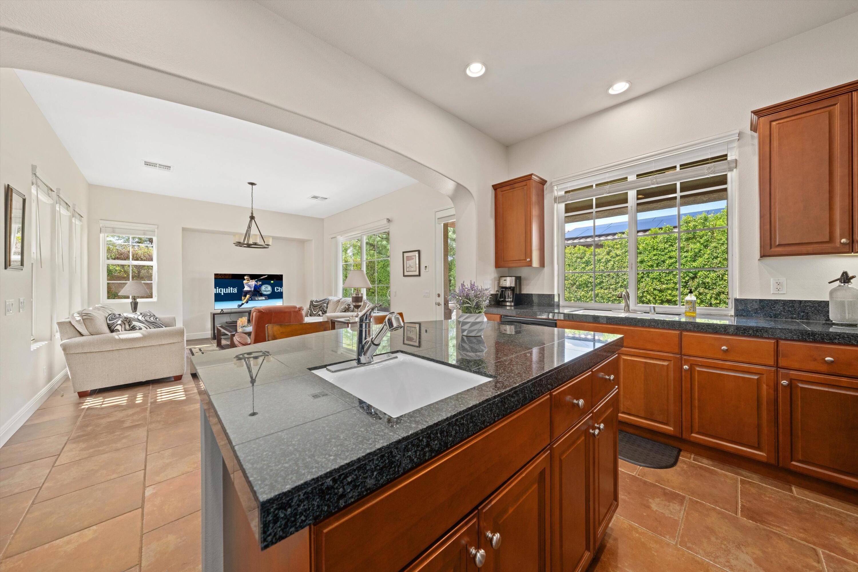 2 Via Santa Elena Rancho Mirage, CA 92270 - Photo 19 of 51 a large kitchen with kitchen island a large counter top space a sink cabinets and appliances