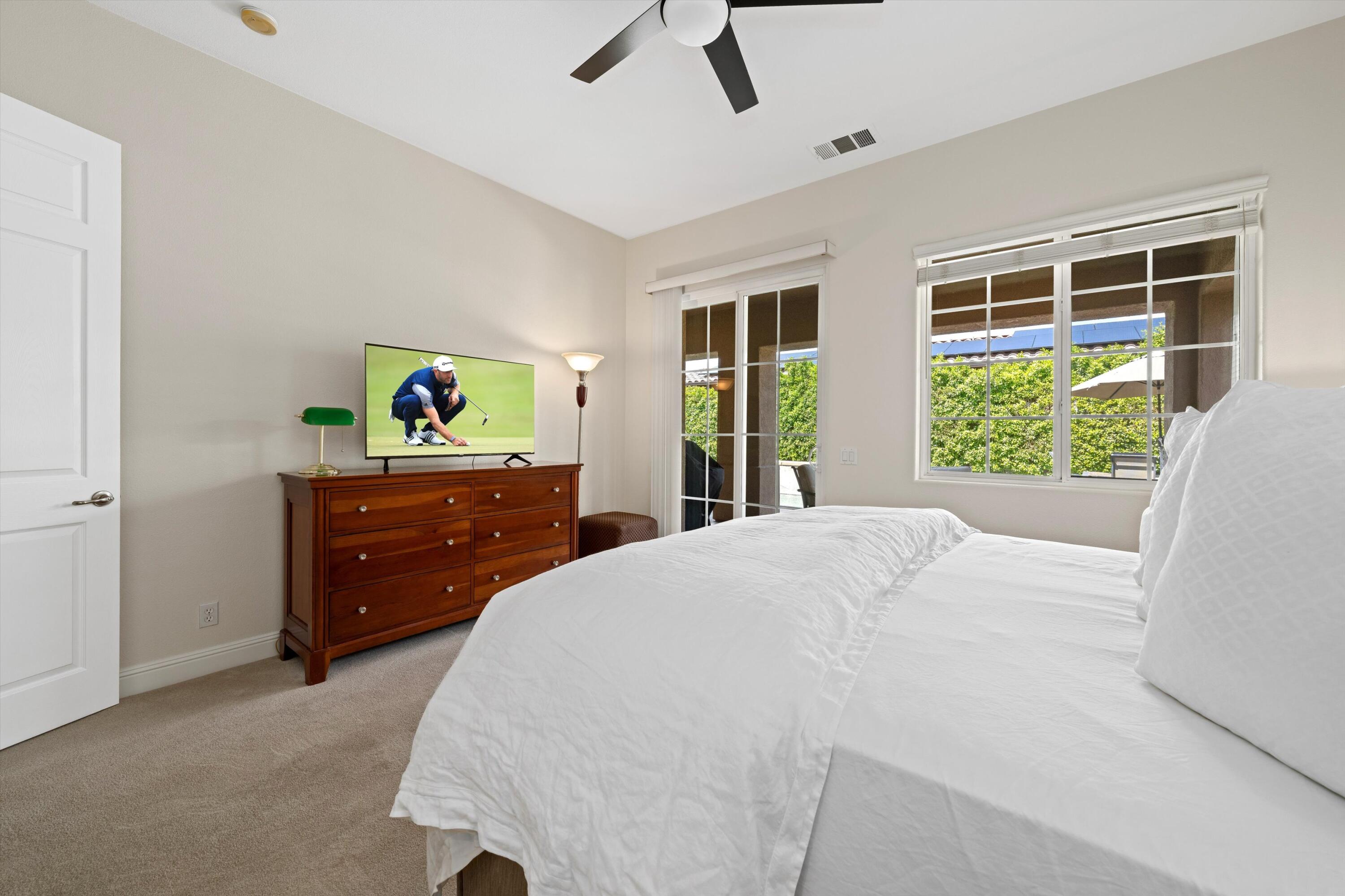 2 Via Santa Elena Rancho Mirage, CA 92270 - Photo 22 of 51 a bedroom with a bed and a window