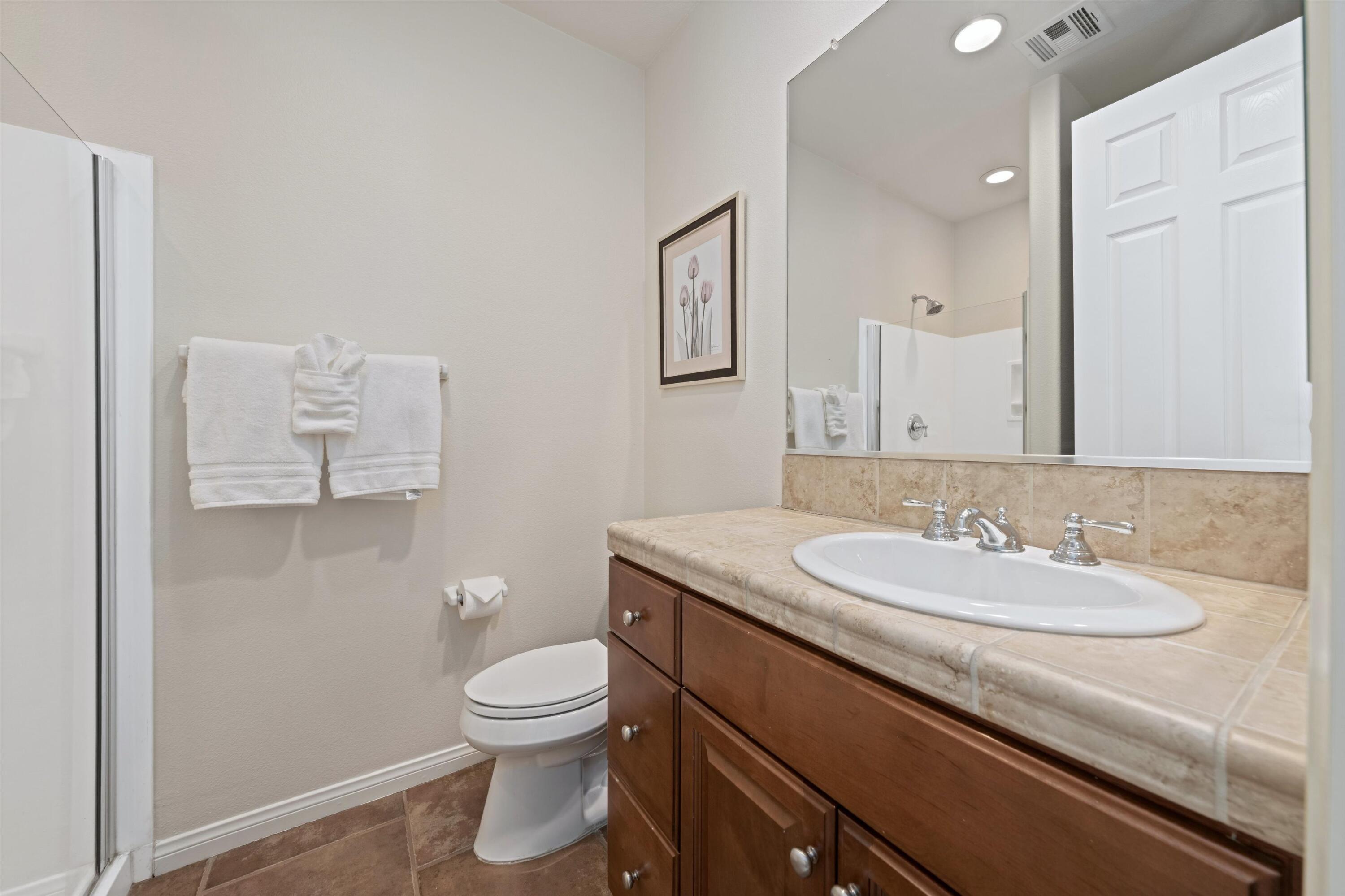 2 Via Santa Elena Rancho Mirage, CA 92270 - Photo 30 of 51 a bathroom with a granite countertop toilet sink and mirror