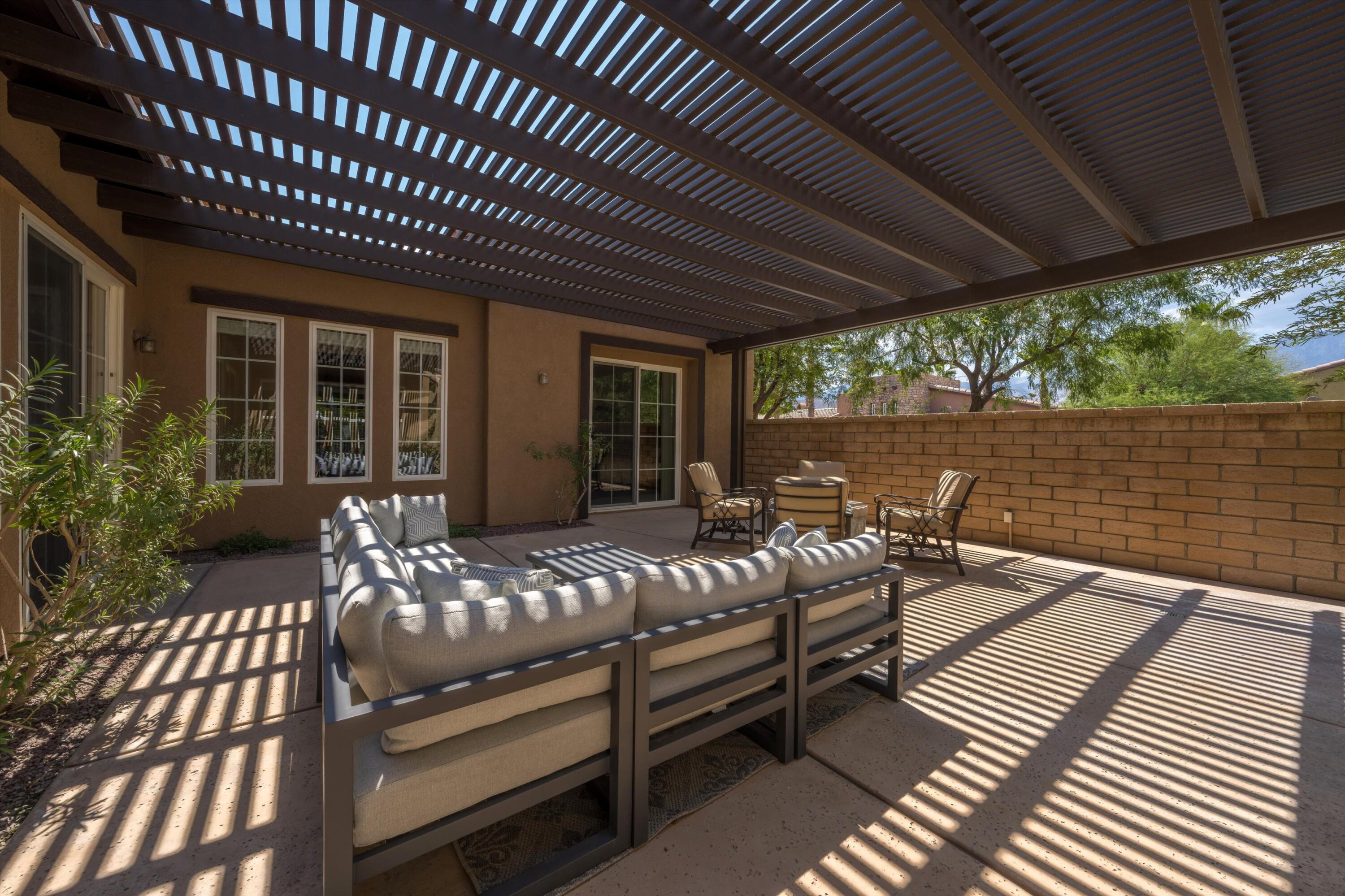 2 Via Santa Elena Rancho Mirage, CA 92270 - Photo 34 of 51 a view of a patio with chairs and wooden floor