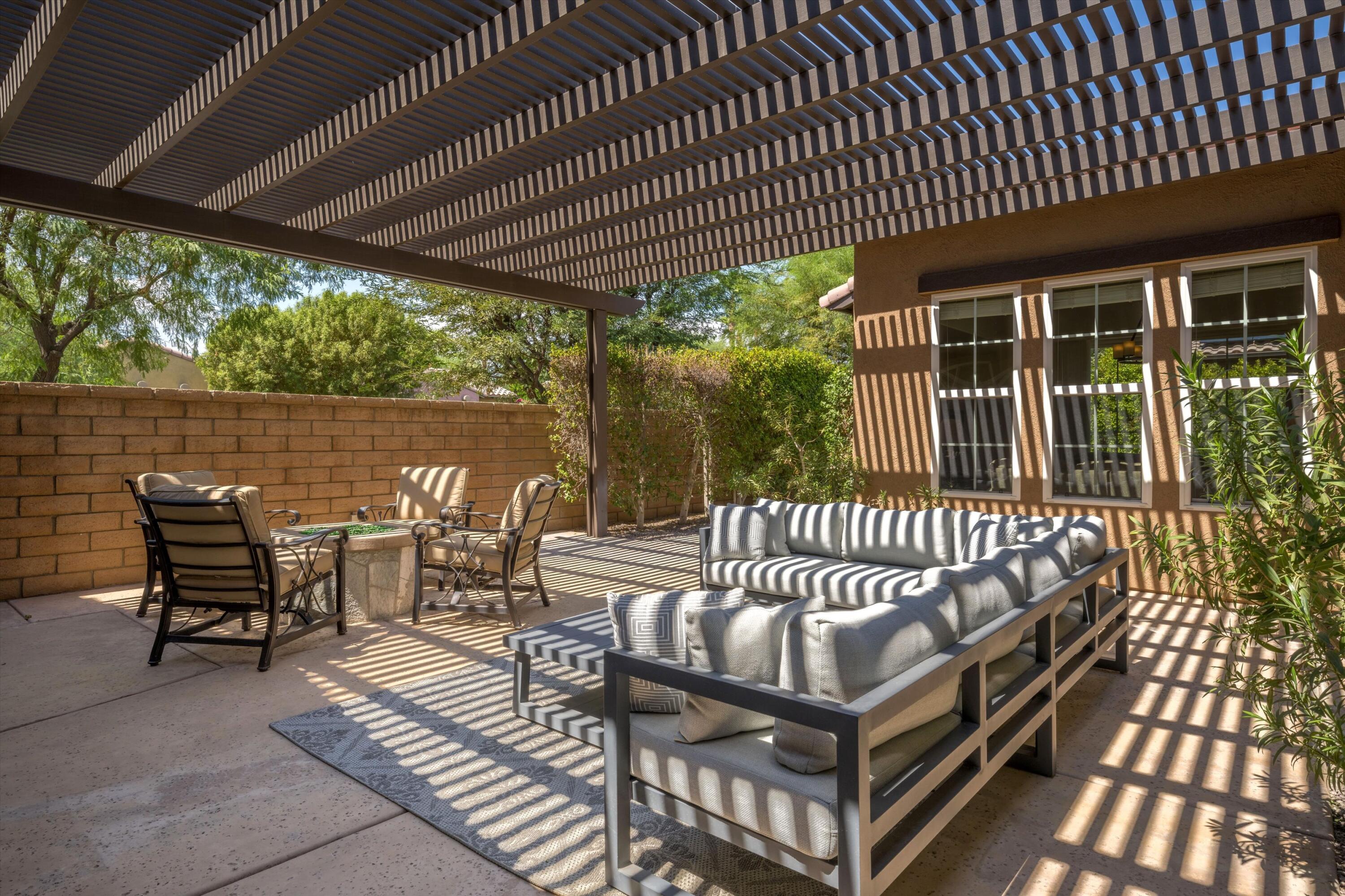 2 Via Santa Elena Rancho Mirage, CA 92270 - Photo 5 of 51 a roof deck with table and chairs and potted plants