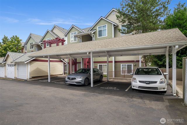 a view of a car park in front of house