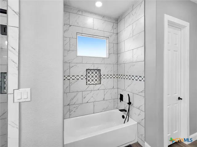 a bathroom with a bathtub