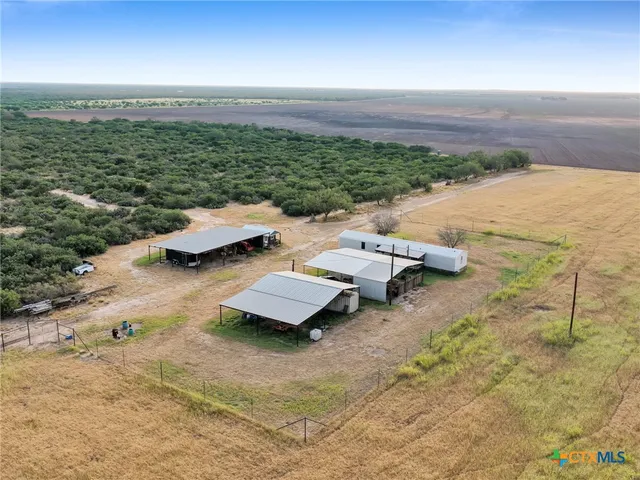 an aerial view of a city with ocean view