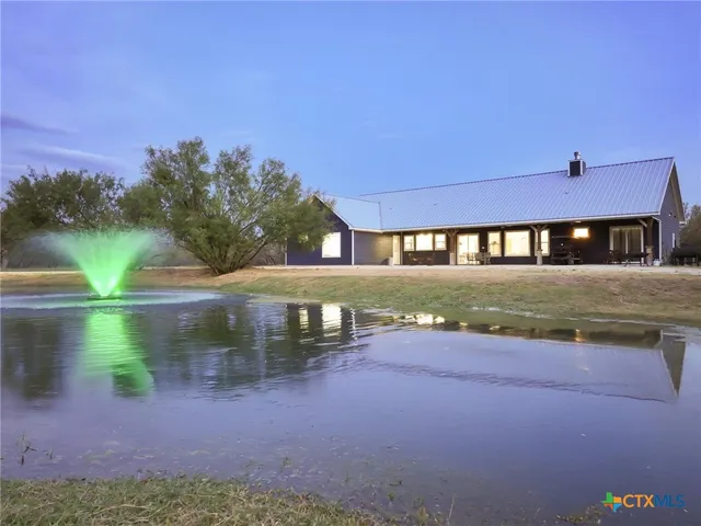 a view of a street with a yard