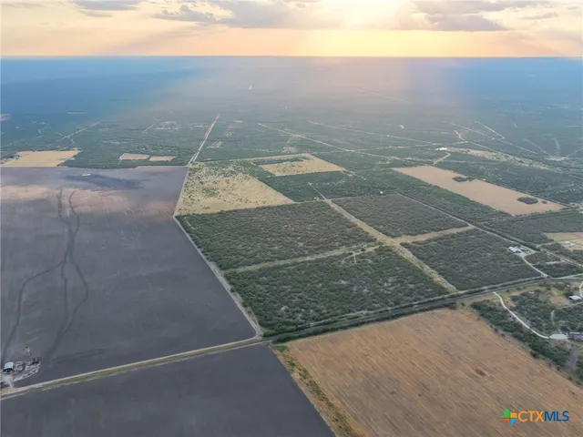 an aerial view of house with yard