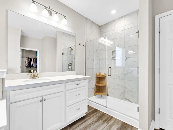 a bedroom with a bed and cabinets