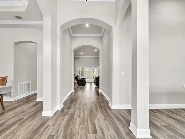 a view of a room with wooden floor staircase and living room