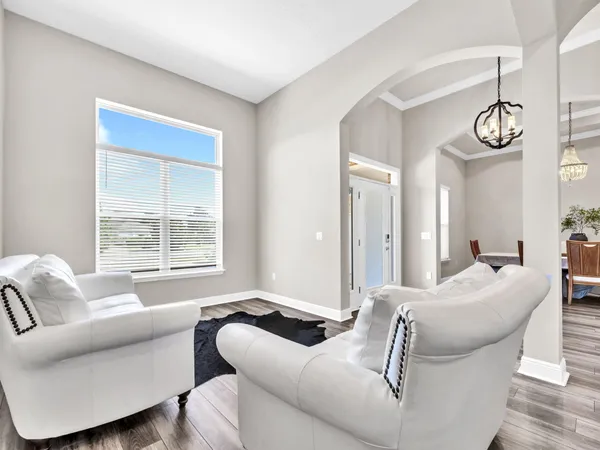 a living room with furniture and a window