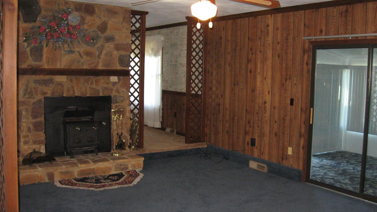 167 Stonebridge Drive Blue Ridge, VA 24064 - Photo 3 of 4 a view of a livingroom with wooden floor and a fireplace