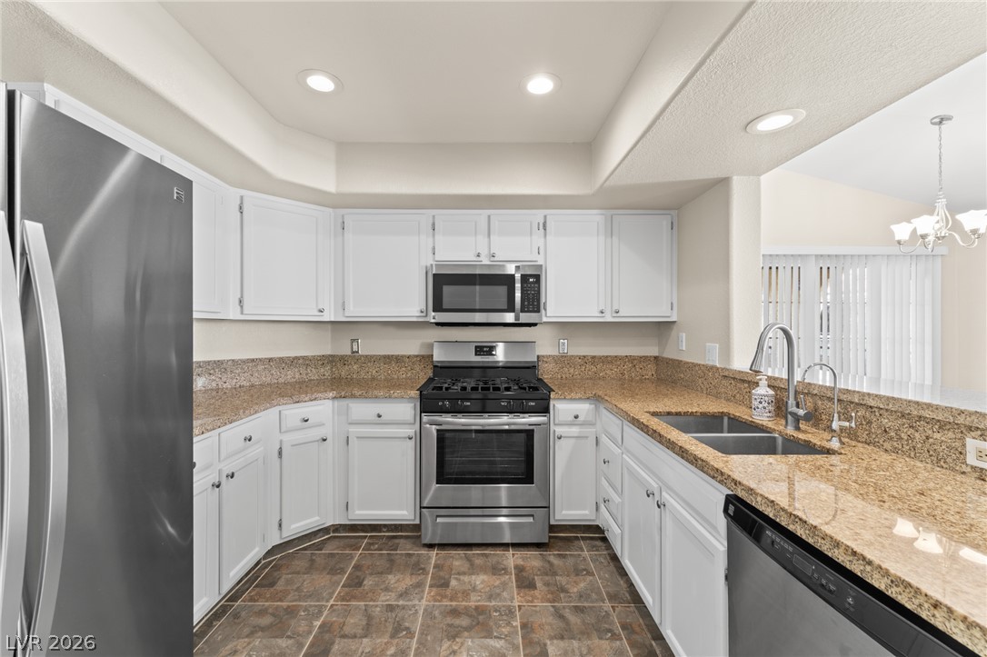 7950 West Flamingo Road, Unit 2142 Las Vegas, NV 89147 - Photo 13 of 24 A well-appointed culinary space featuring sleek stainless steel appliances and abundant counter space.