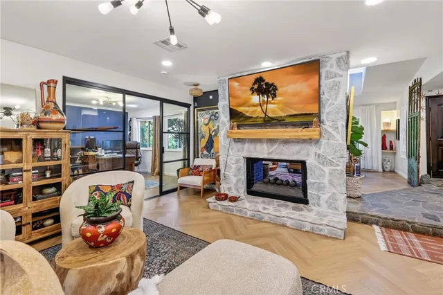 a kitchen with granite countertop stainless steel appliances a stove a sink and a refrigerator